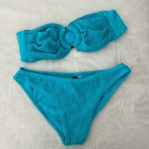 One Size. Never worn. Love & Bikinis set.